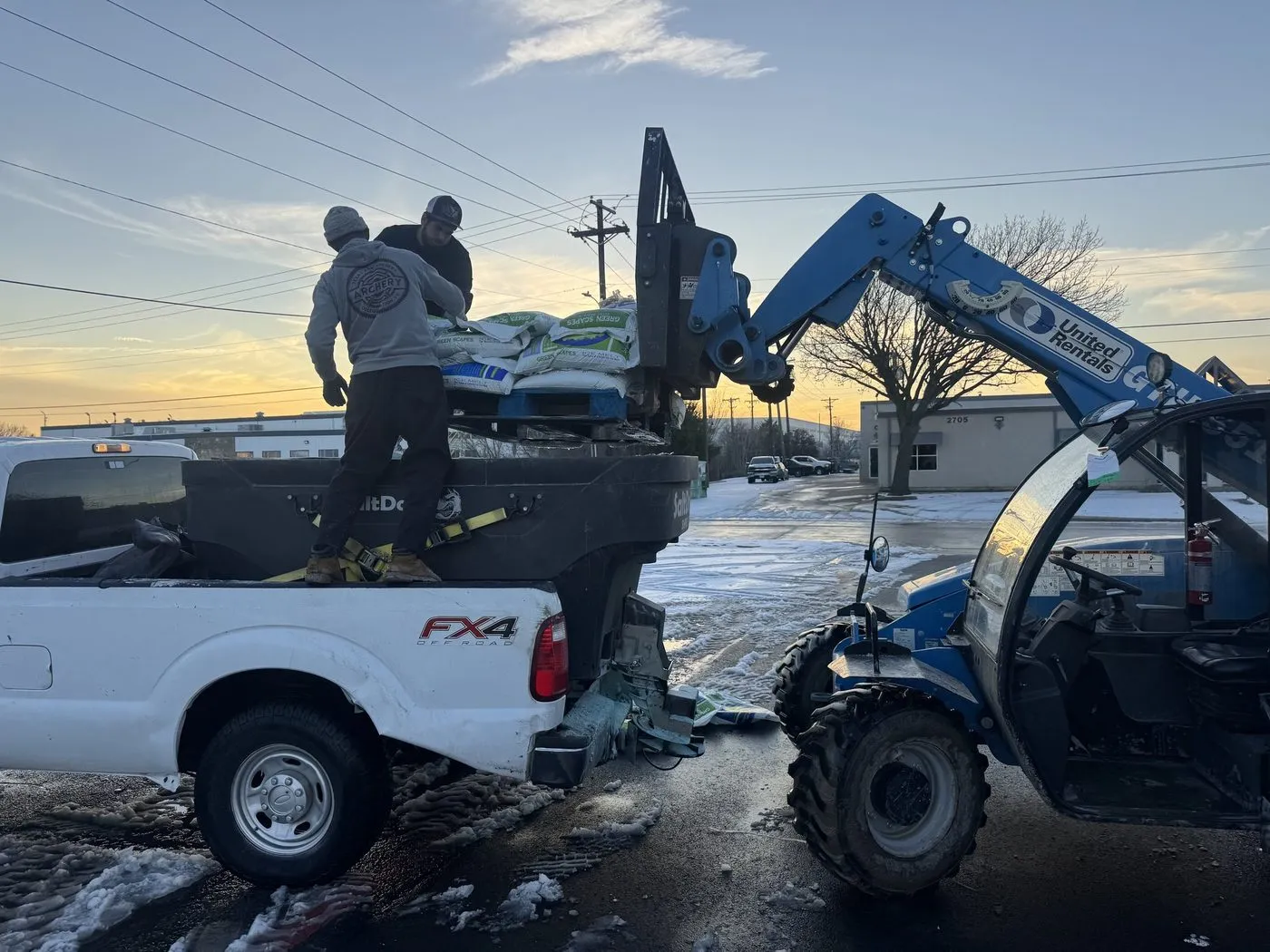 Daltex crew loading ice melt onto a service truck before a winter storm